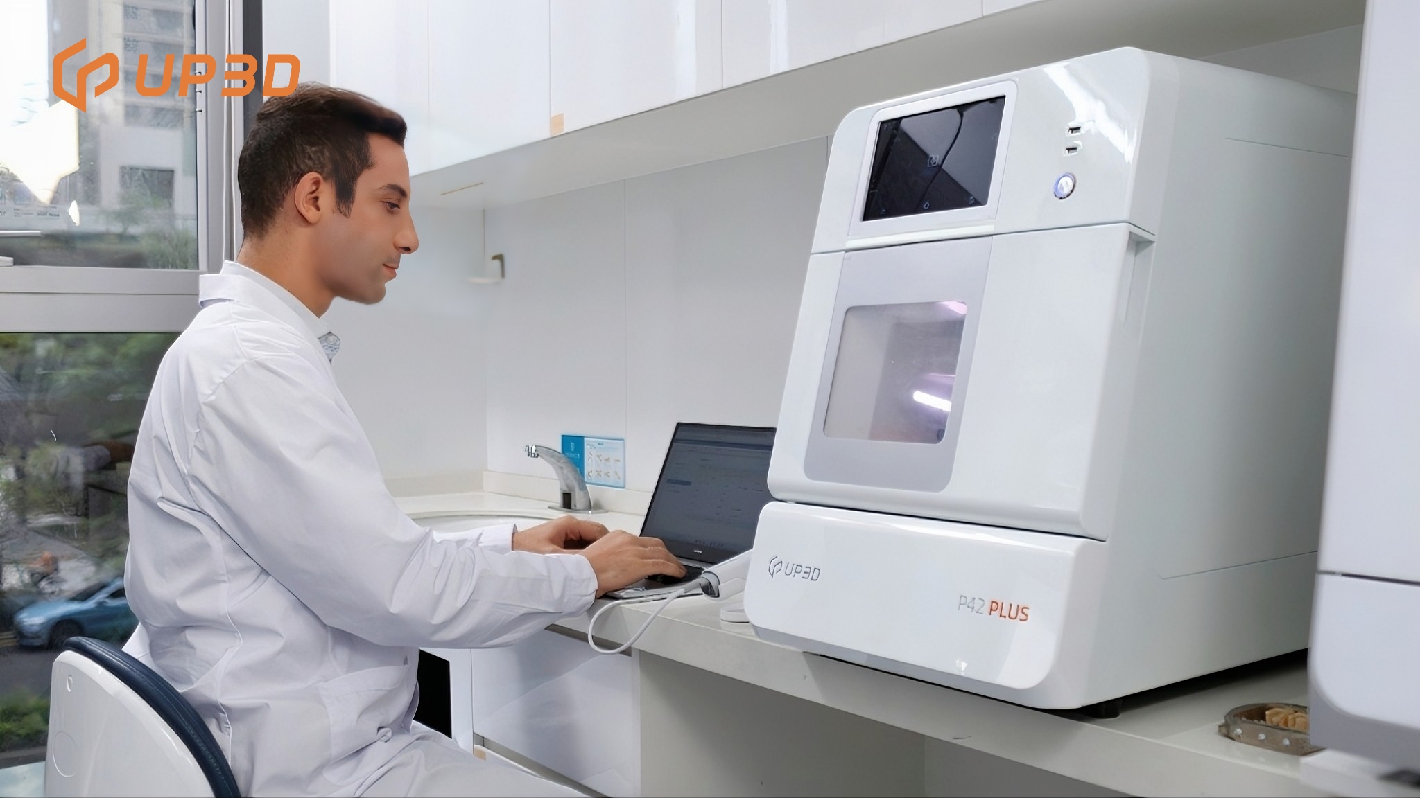 Dentist using UP3D P42 PLUS wet milling machine as part of SOREAL chairside dentistry system for same-day restorations