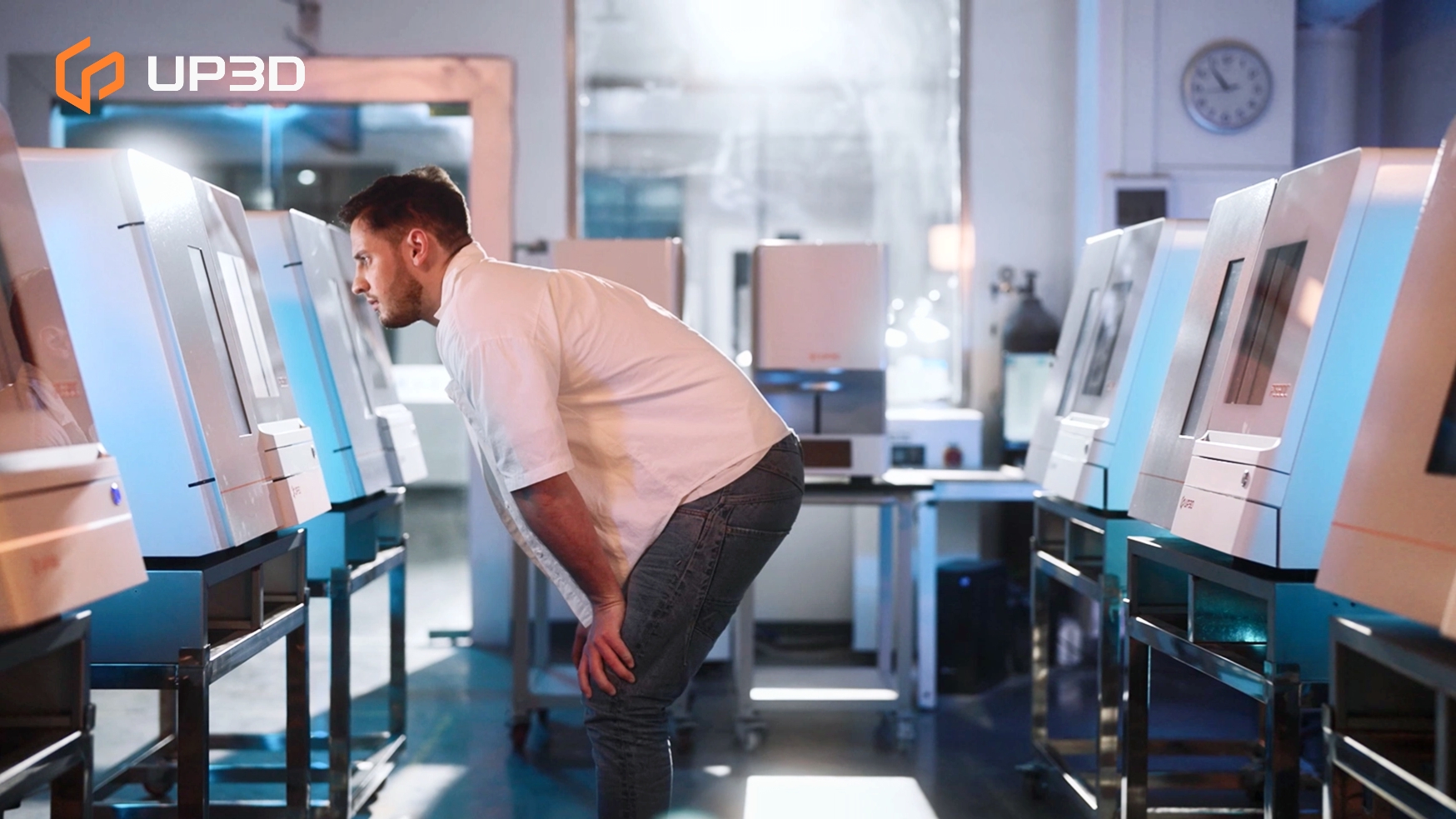 Technician monitoring multiple UP3D dental milling machines in an advanced digital dental lab, representing the automation and digital transformation of dental manufacturing in 2026.