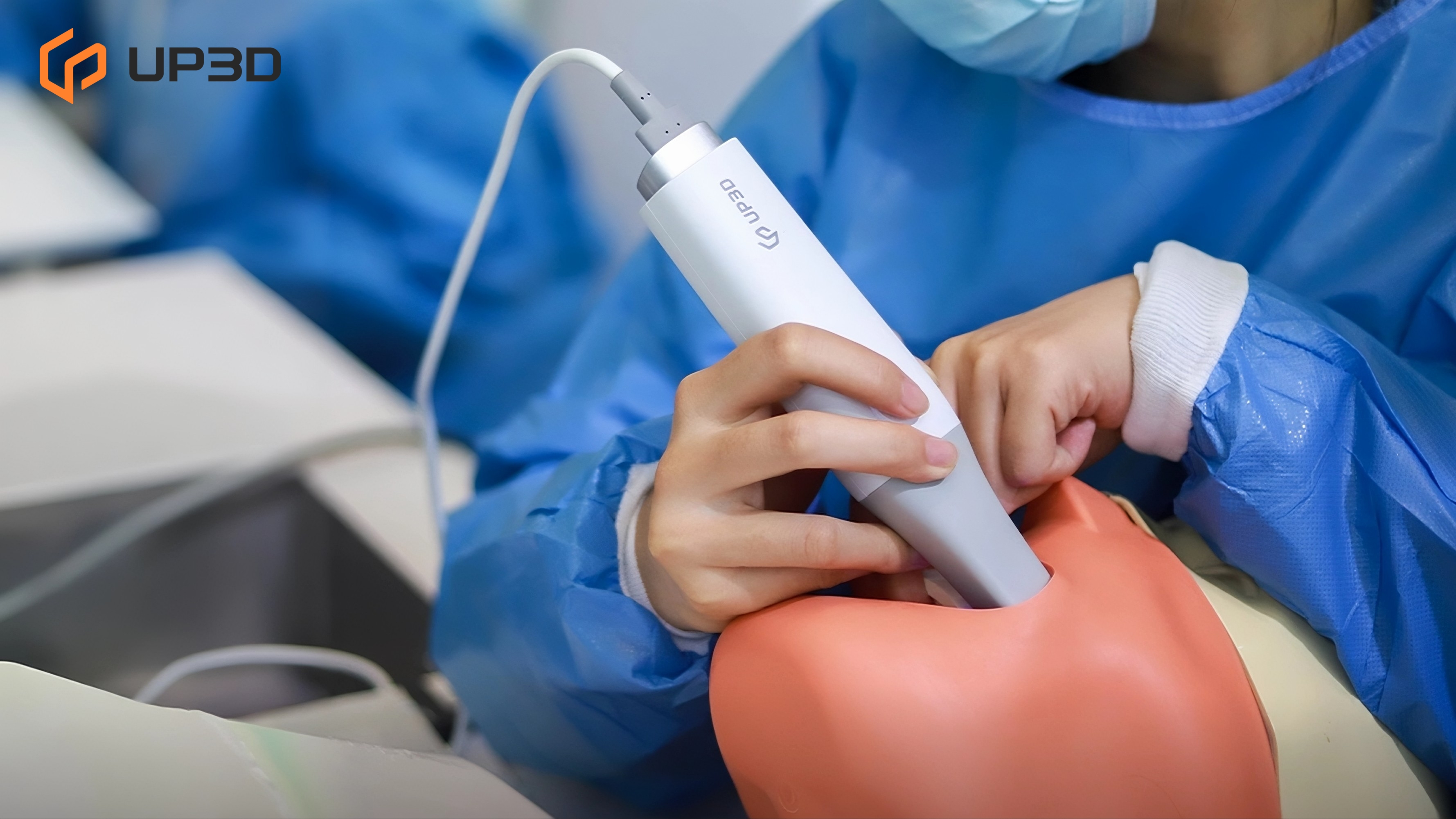 Dental professional cleaning and disinfecting a UP3D intraoral scanner tip during sterilization workflow.
