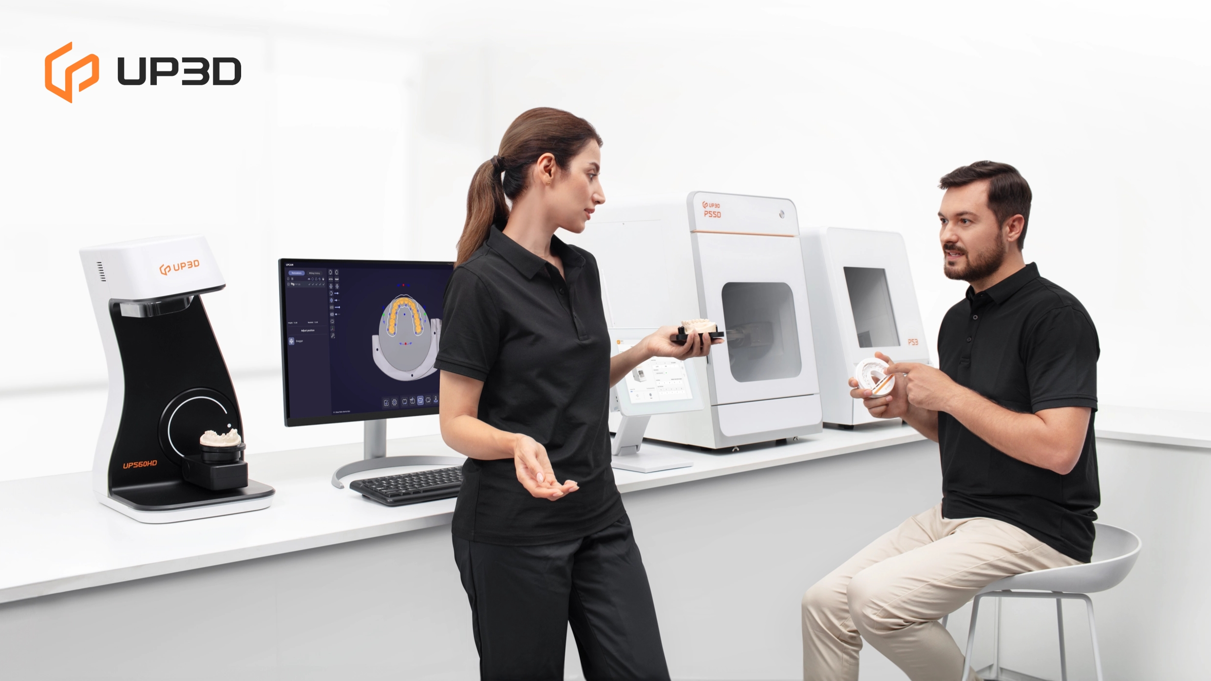 Two dental professionals discussing digital CAD/CAM design using UP3D lab scanner and P55D milling machine, showcasing collaboration in a modern digital dentistry workflow.