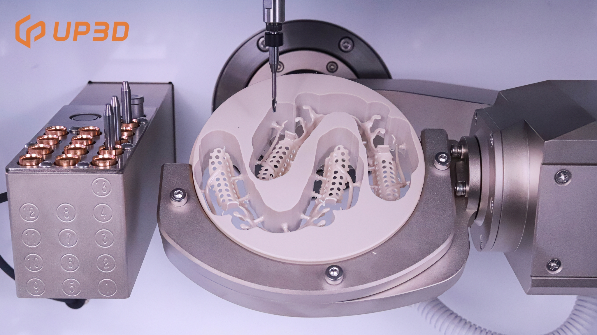 Close-up of UP3D dental milling machine cutting PEEK disc, showing toolpath strategies for burr prevention